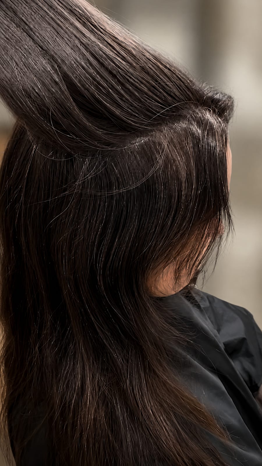 A dark brown grey blend, section lifted to show dimension